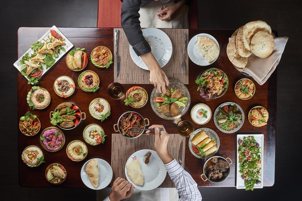 Four Seasons Cairo At The First Residence Giza Ngoại thất bức ảnh A selection of dishes at a restaurant in Dubai